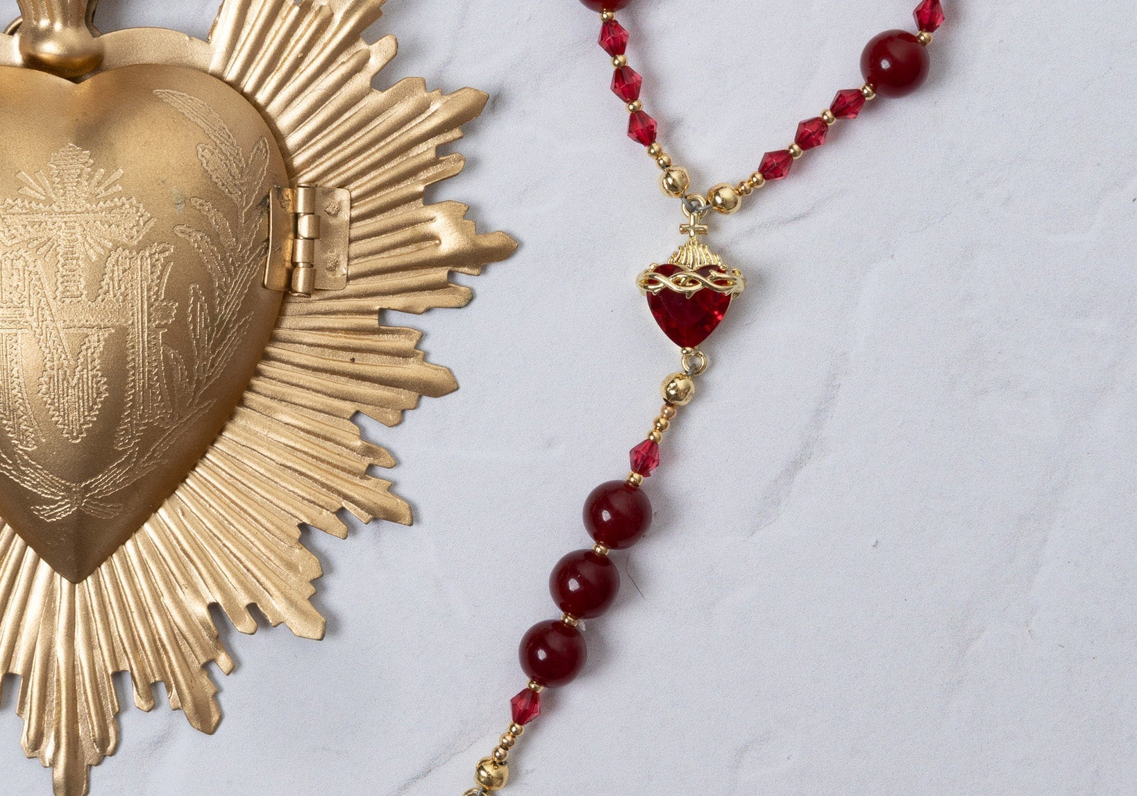 Red and gold Seven Sorrows rosary with faceted beads and crucifix