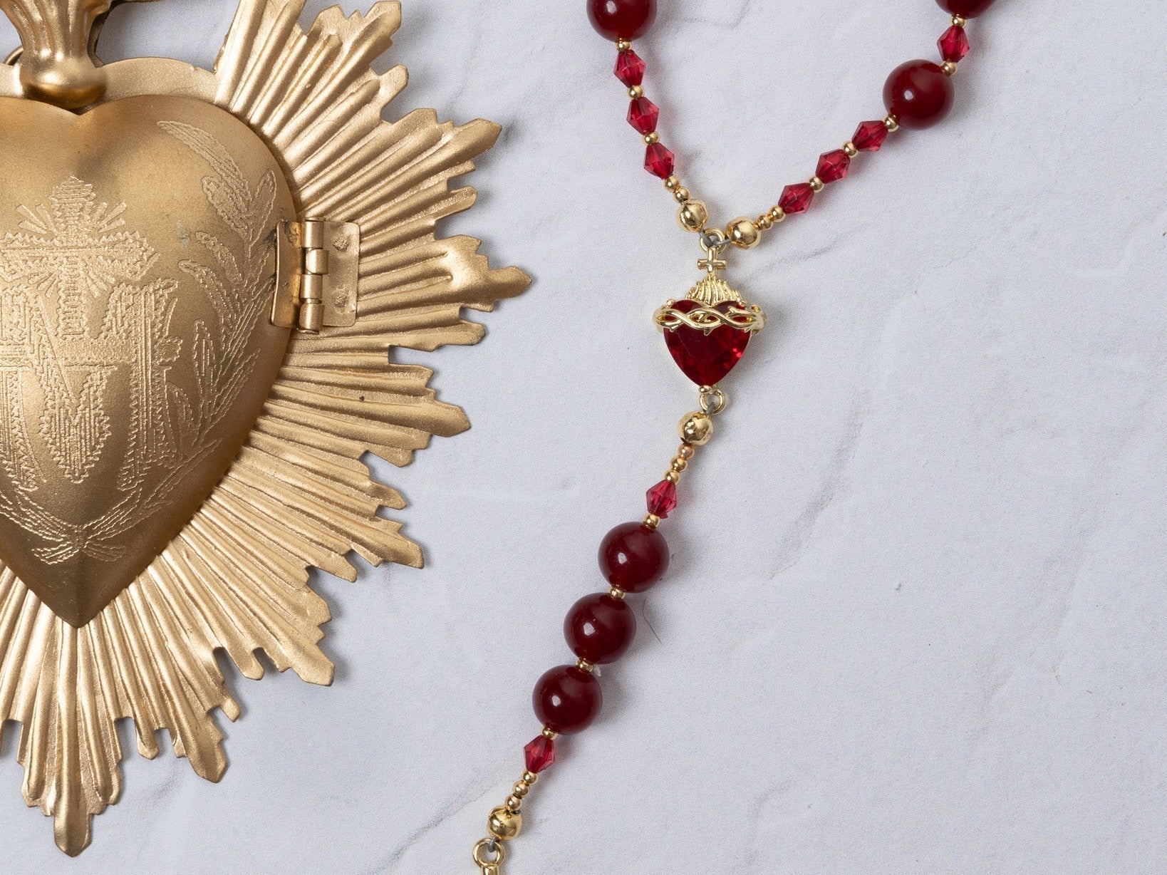 Red and gold Seven Sorrows rosary with faceted beads and crucifix