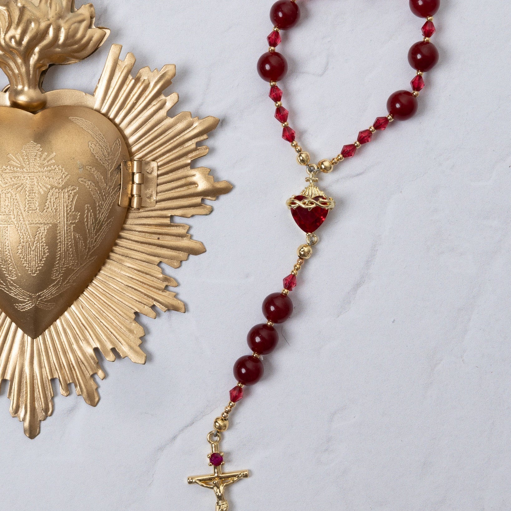 Red and gold Seven Sorrows rosary with faceted beads and crucifix