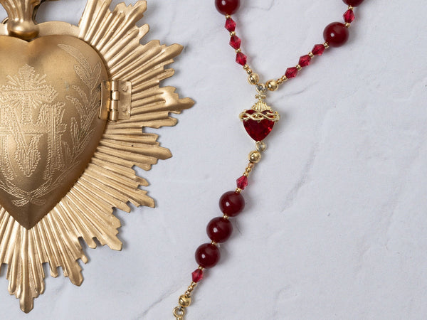 Red and gold Seven Sorrows rosary with faceted beads and crucifix