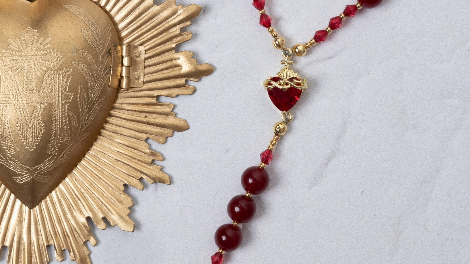 Red and gold Seven Sorrows rosary with faceted beads and crucifix