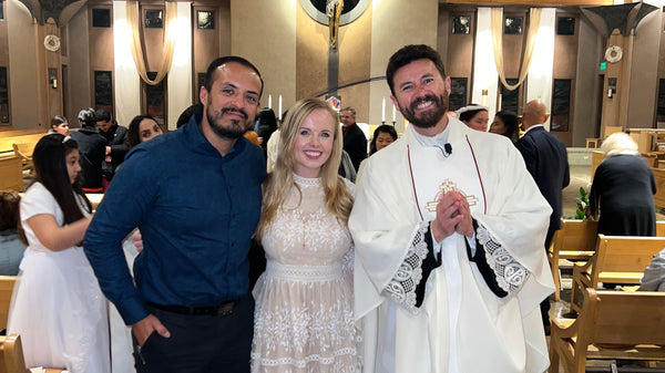 White lace dress with floral embroidery in Catholic conversion story