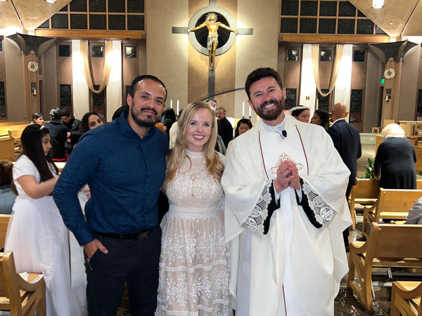 White lace dress with floral embroidery in Catholic conversion story