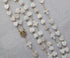 pearl heart shaped rosary with luminous heart beads and delicate cross accents, featuring Mother Mary centerpiece