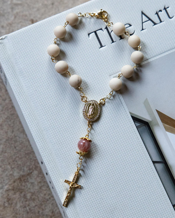 Soft Glory Car Decade Rosary: gold rosary bracelet with cream beads, pink gem, cross medallion