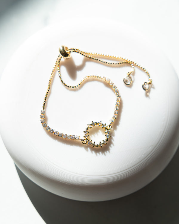 Gold-toned Crown of Thorns adjustable bracelet with crystal-encrusted circular design