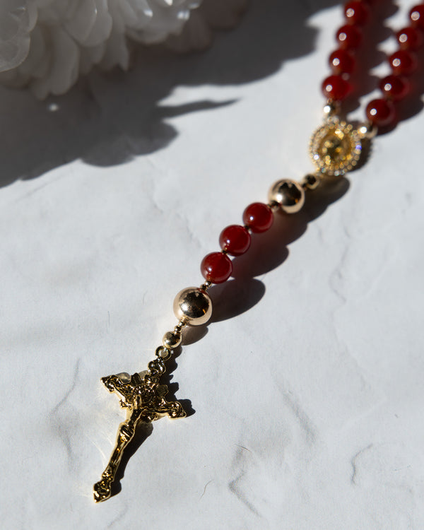 Sanguis Christi Garnet Rosary with red and gold beads and crucifix pendant