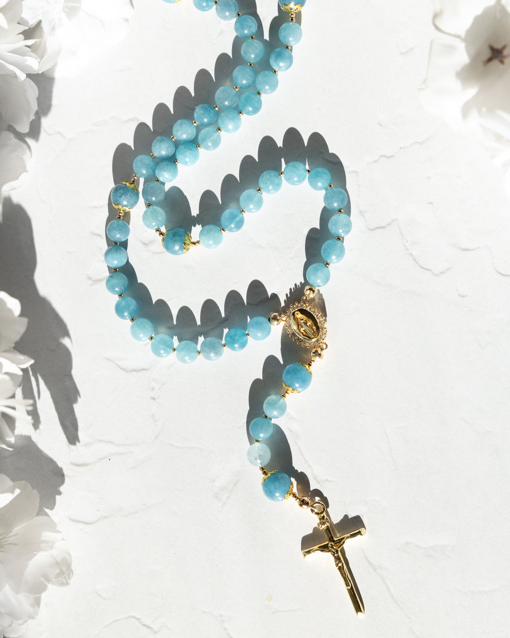 Delicate light blue jade Queen of Heaven Rosary with gold accents and crucifix