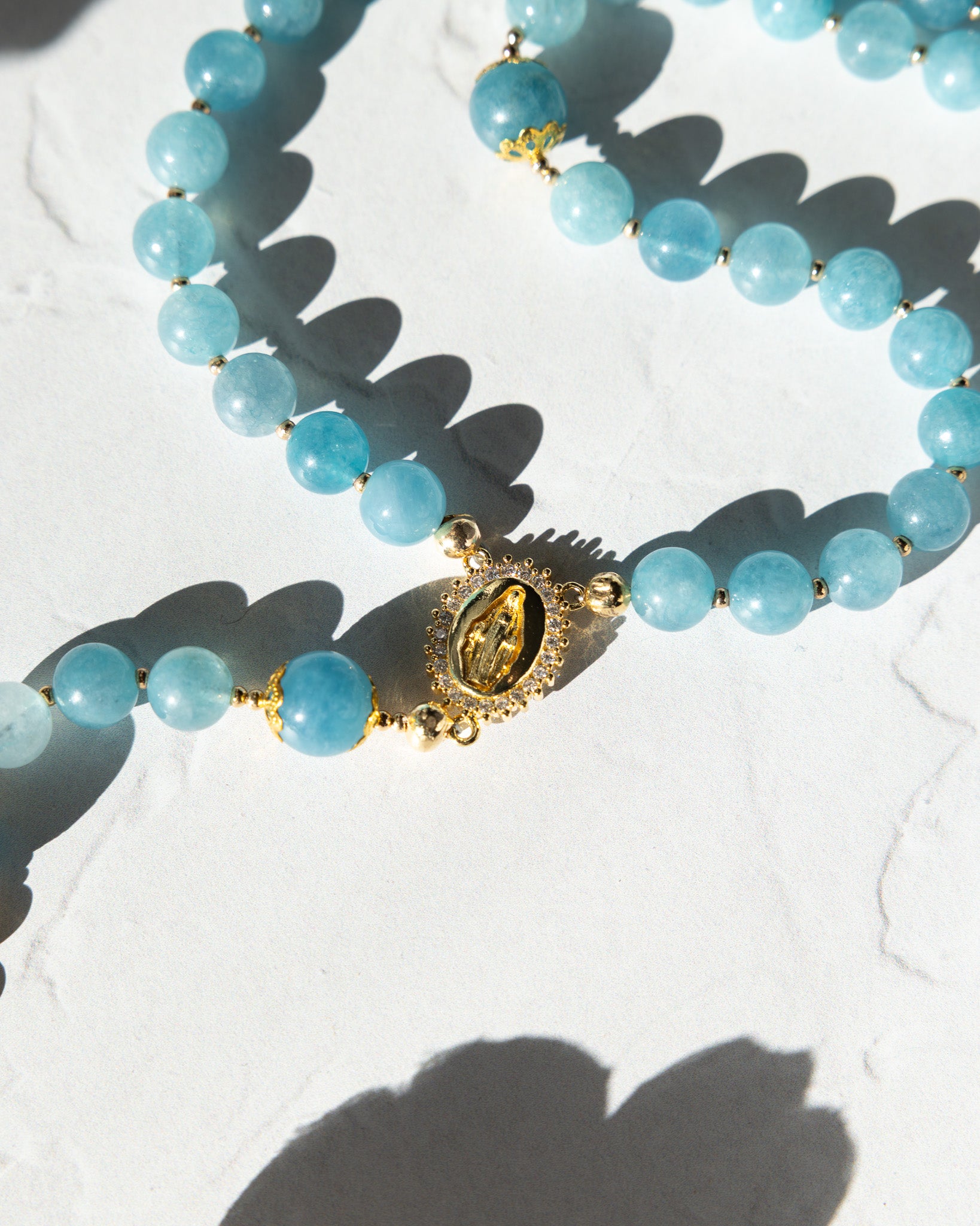Delicate light blue jade bead Queen of Heaven Rosary with gold centerpiece