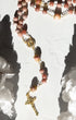 Mater Amoris rosary with pink translucent gemstone beads and gold crucifix
