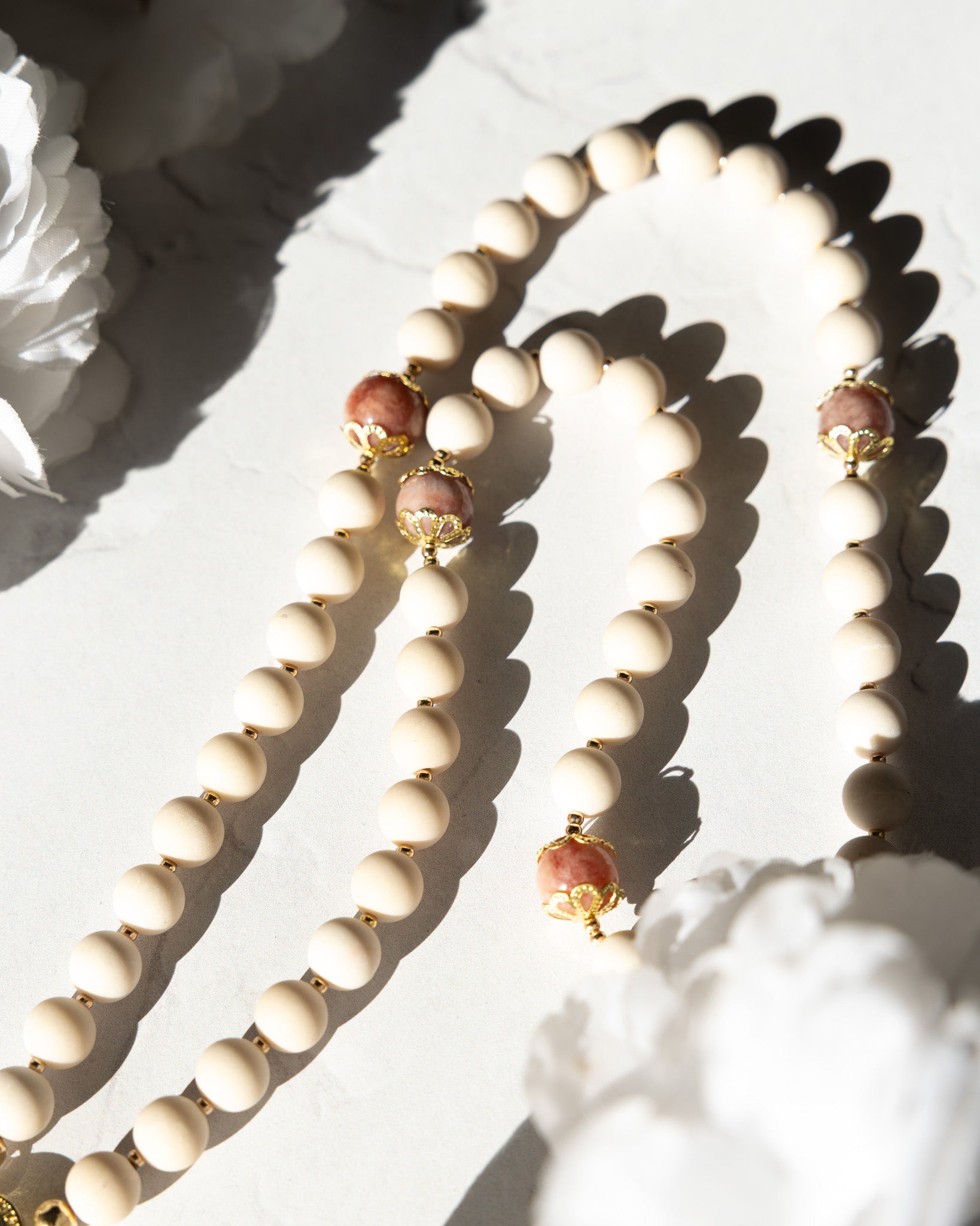 Soft Glory Rosary: cream beaded necklace with gold accents and pink gems