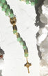 Jadeite rosary with delicate jade green beads, gold accents, and crucifix