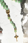 Jadeite rosary with delicate jade green beads, gold accents, and crucifix