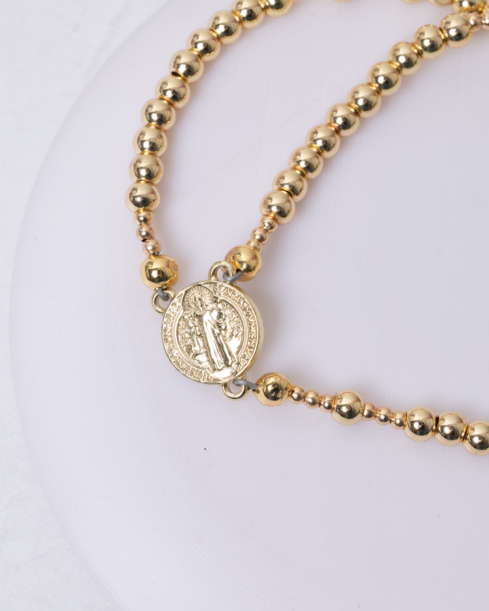 Gold-toned beaded 14K magnetic rosary bracelet with Saint Benedict medal charm