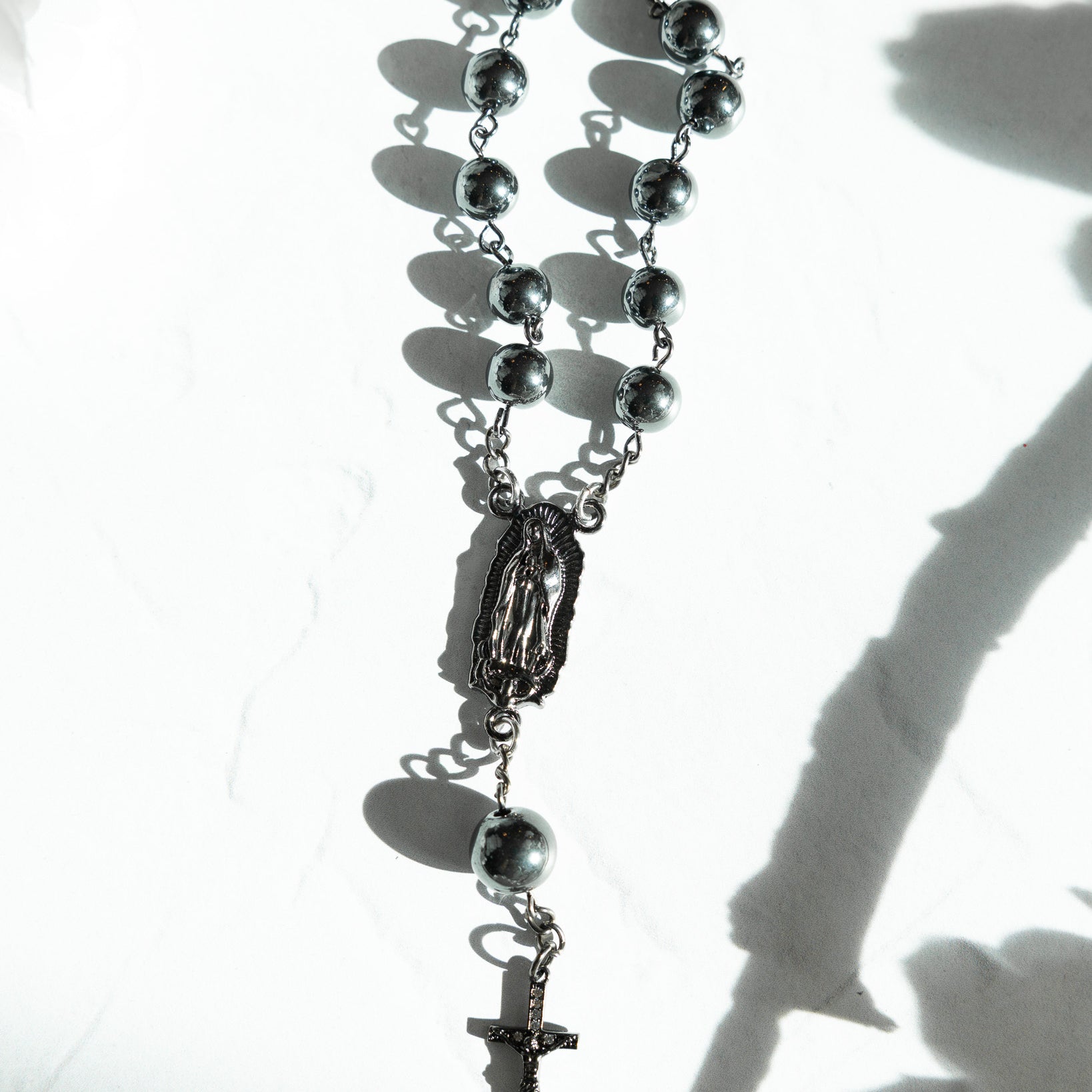 Silver-toned Armor of God car rosary with spherical beads and crucifix