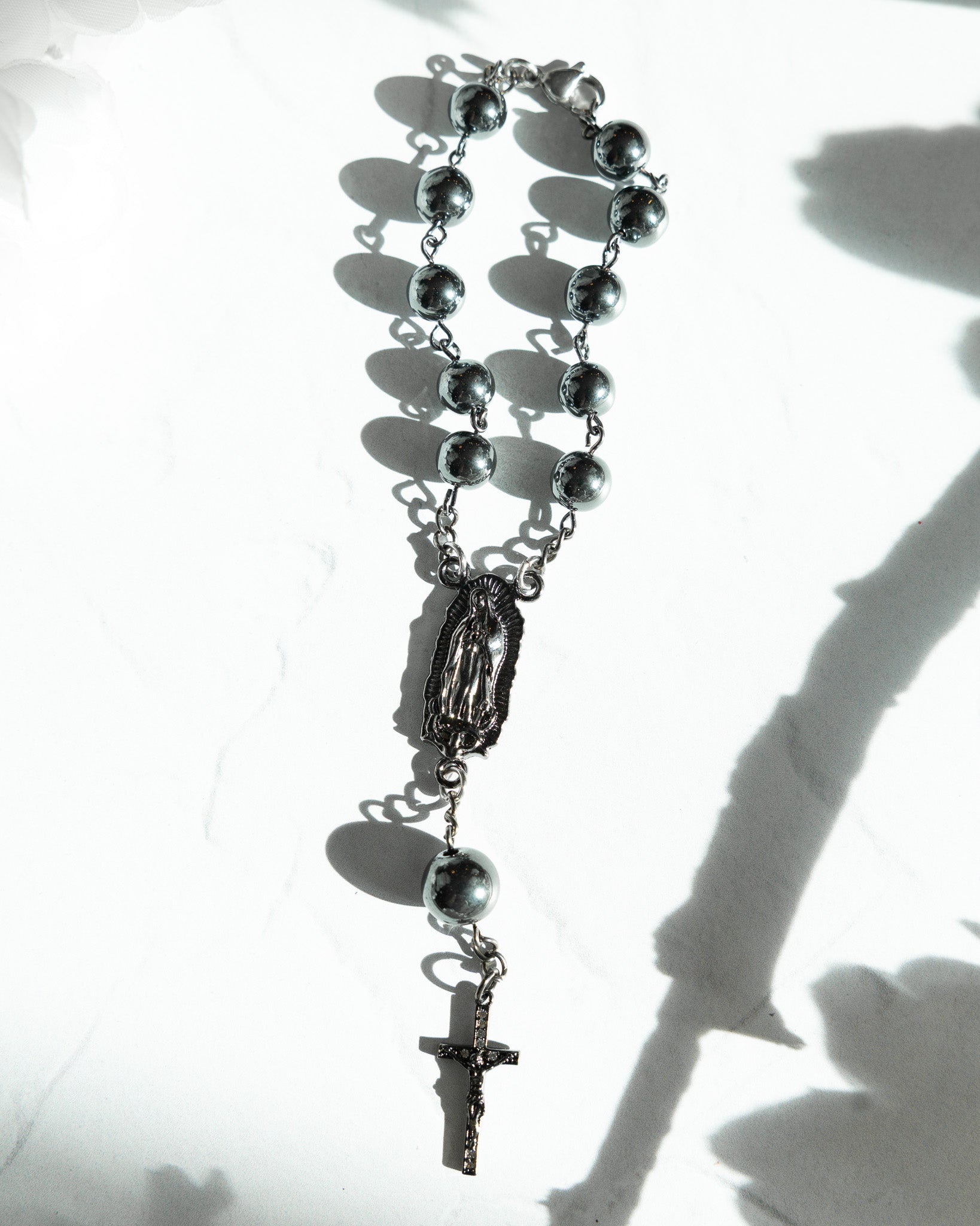 Silver-toned Armor of God car rosary with spherical beads and crucifix