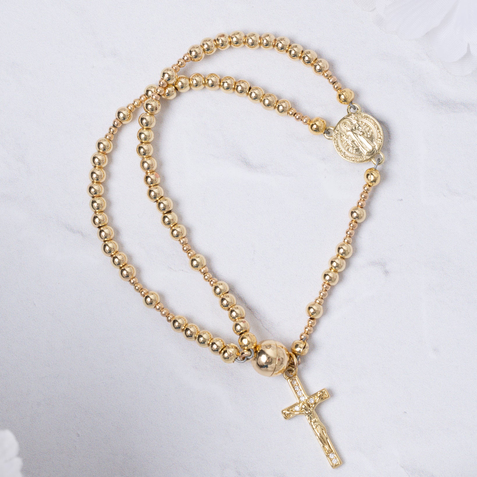 14K gold magnetic rosary bracelet with beaded design, medallion, and cross pendant