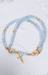 Stella Maris light blue beaded magnetic rosary bracelet with gold accents, cross charm, oval medallion