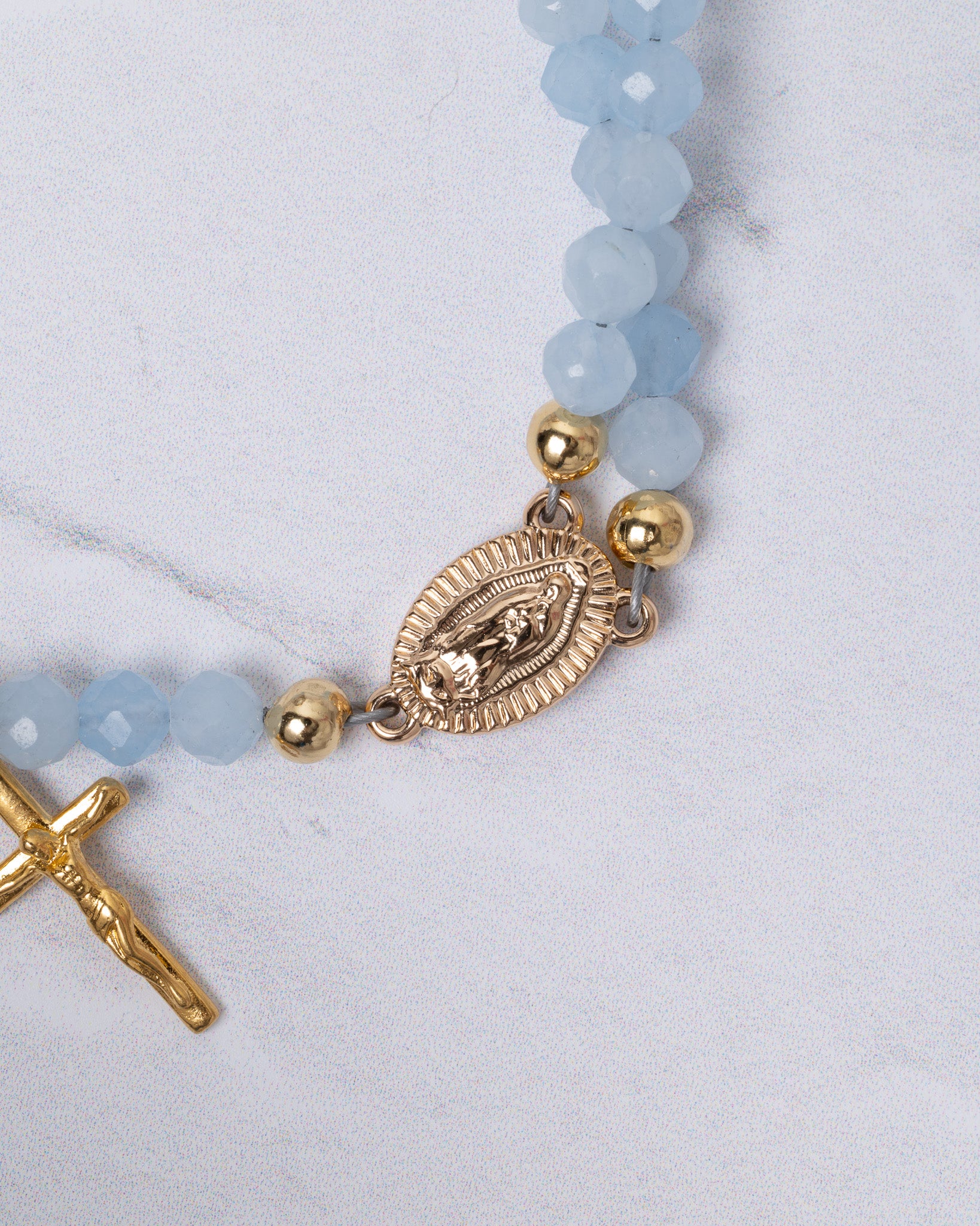 Delicate light blue faceted bead Stella Maris rosary bracelet with Virgin of Guadalupe medallion