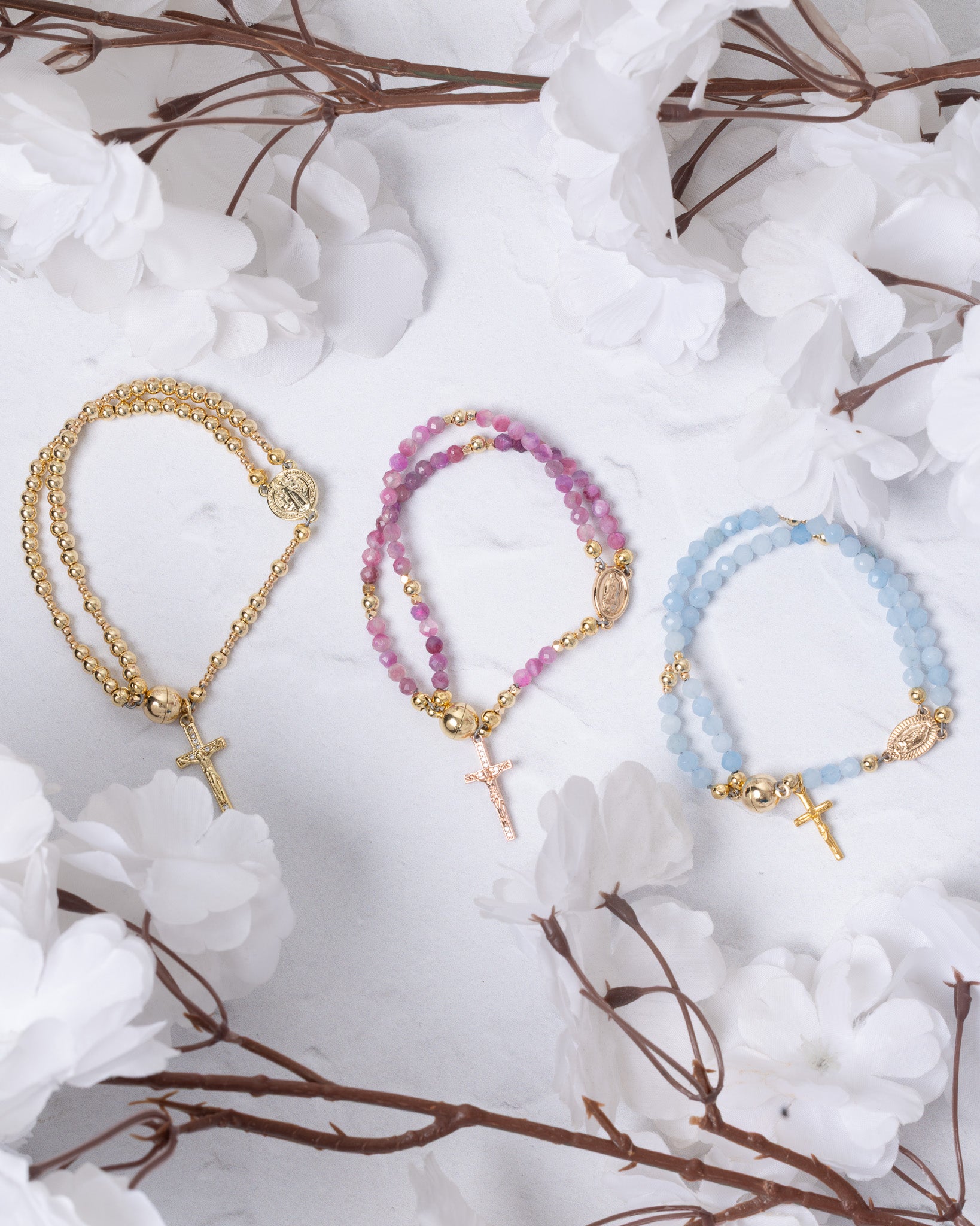 Three 14K gold magnetic rosary beaded bracelets with cross pendants