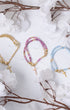 Three Rosa Mystica beaded bracelets with gold cross pendants