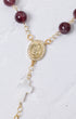 Gold-toned Advent purple car decade rosary with red garnet beads