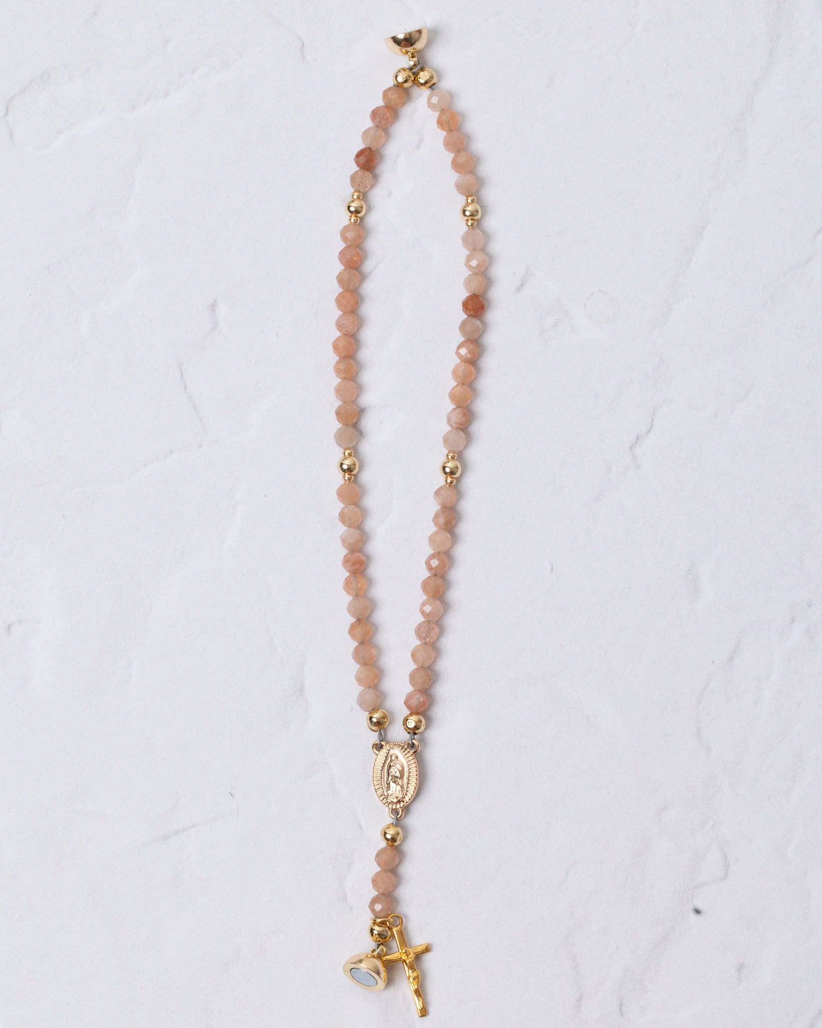 Delicate peach beaded Sunstone Magnetic Rosary Bracelet with gold accents