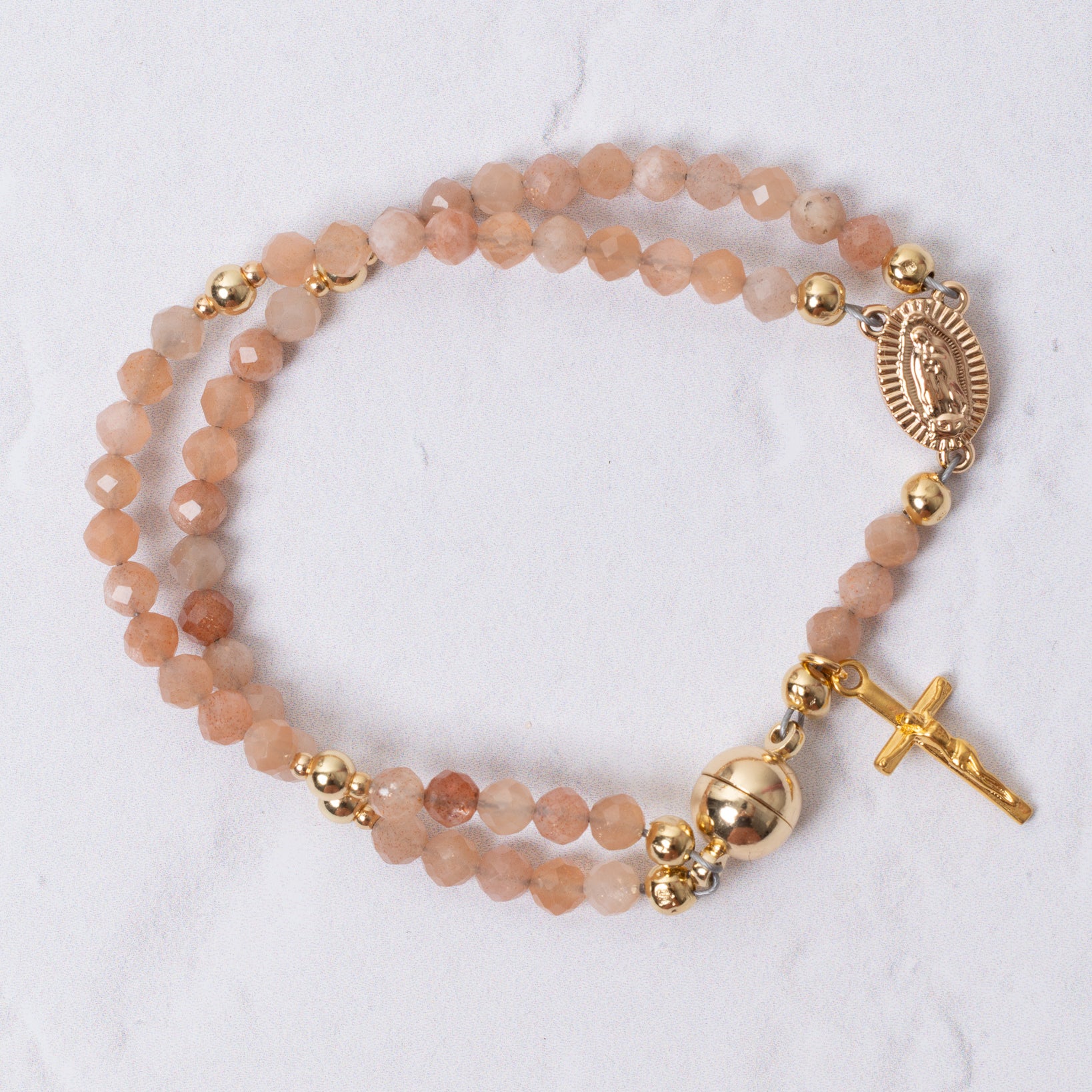 Sunstone magnetic rosary bracelet in delicate peach beads with gold accents