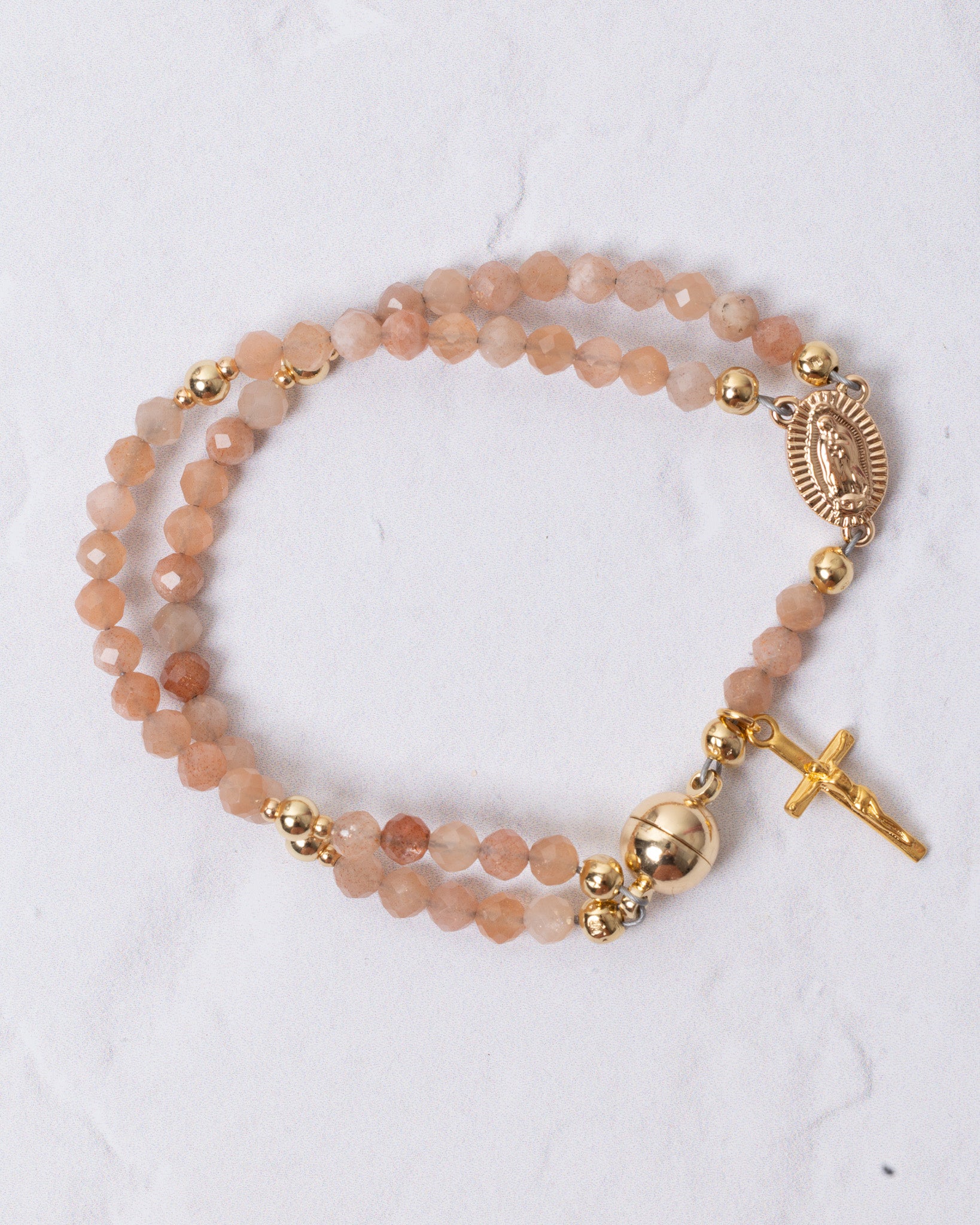 Sunstone magnetic rosary bracelet in delicate peach beads with gold accents