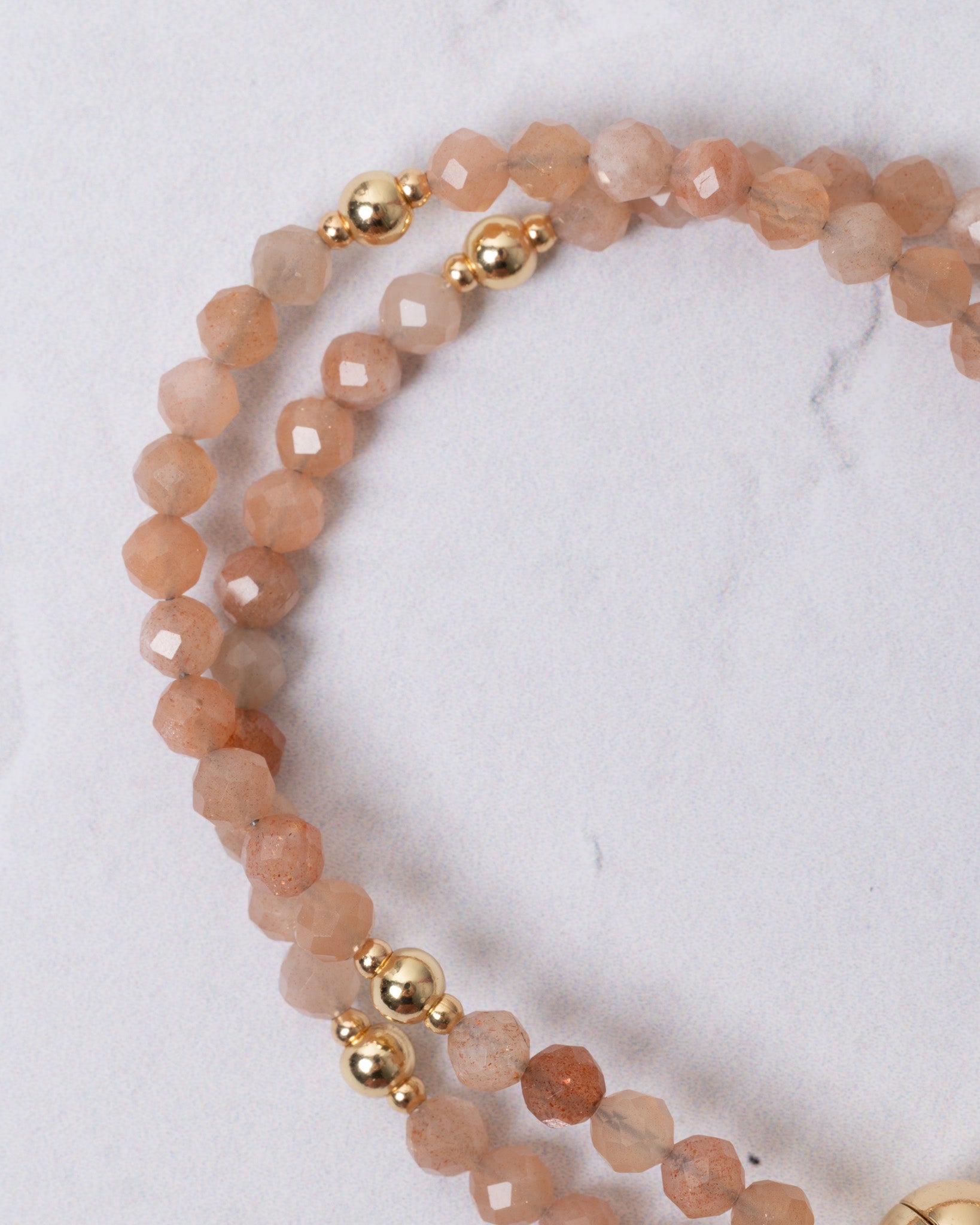 Delicate peach Sunstone Magnetic Rosary Bracelet with beaded faceted gemstones and gold accents