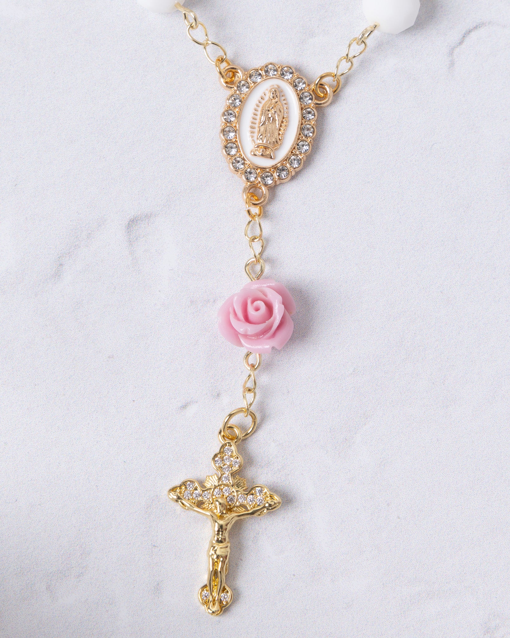 Delicate gold-toned Little Flower Car Decade Rosary with oval medallion and pink rose bead