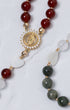 Lady of Guadalupe rosary with gold tone, red beads, and Virgin Mary medallion