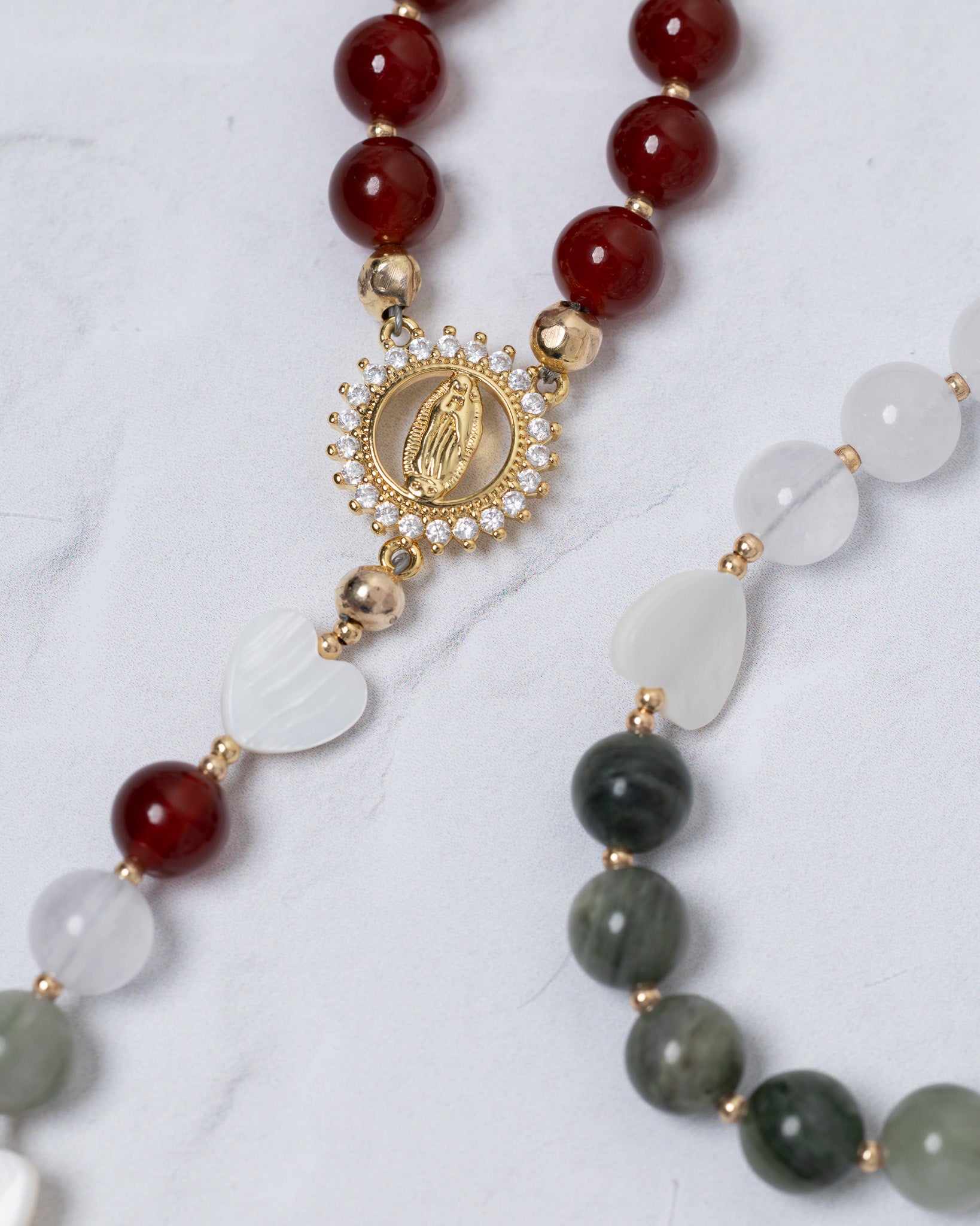 Lady of Guadalupe rosary with gold tone, red beads, and Virgin Mary medallion