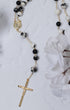 Black and white speckled stone Light of Benediction Rosary with gold chain
