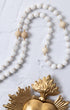 White beaded Immaculata Rosary with gold accents and sacred heart medal