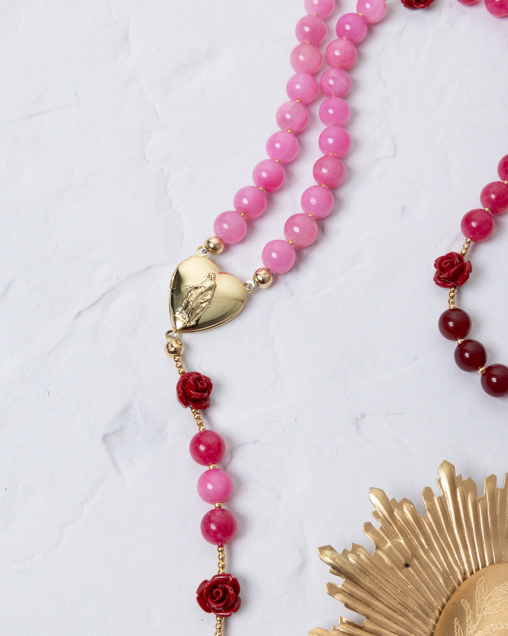 Mater Amoris rosary with pink and red beads, gold heart charm with engraved figure