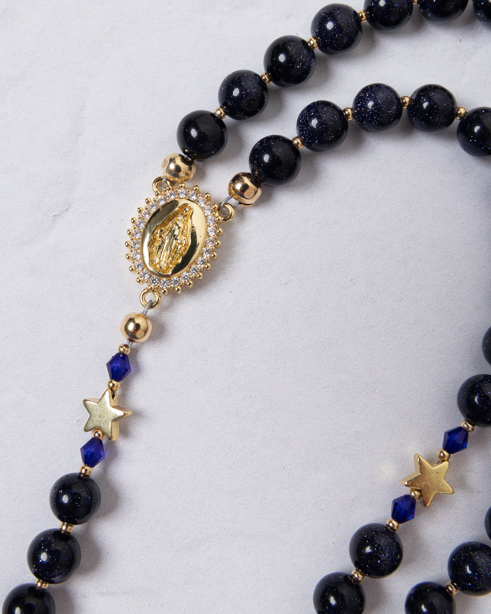Our Lady of Aparecida navy blue and gold rosary with crystal medallion