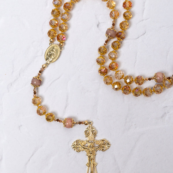 Gloria Dei Rosary with gold rosary, amber pink beads, ornate crucifix