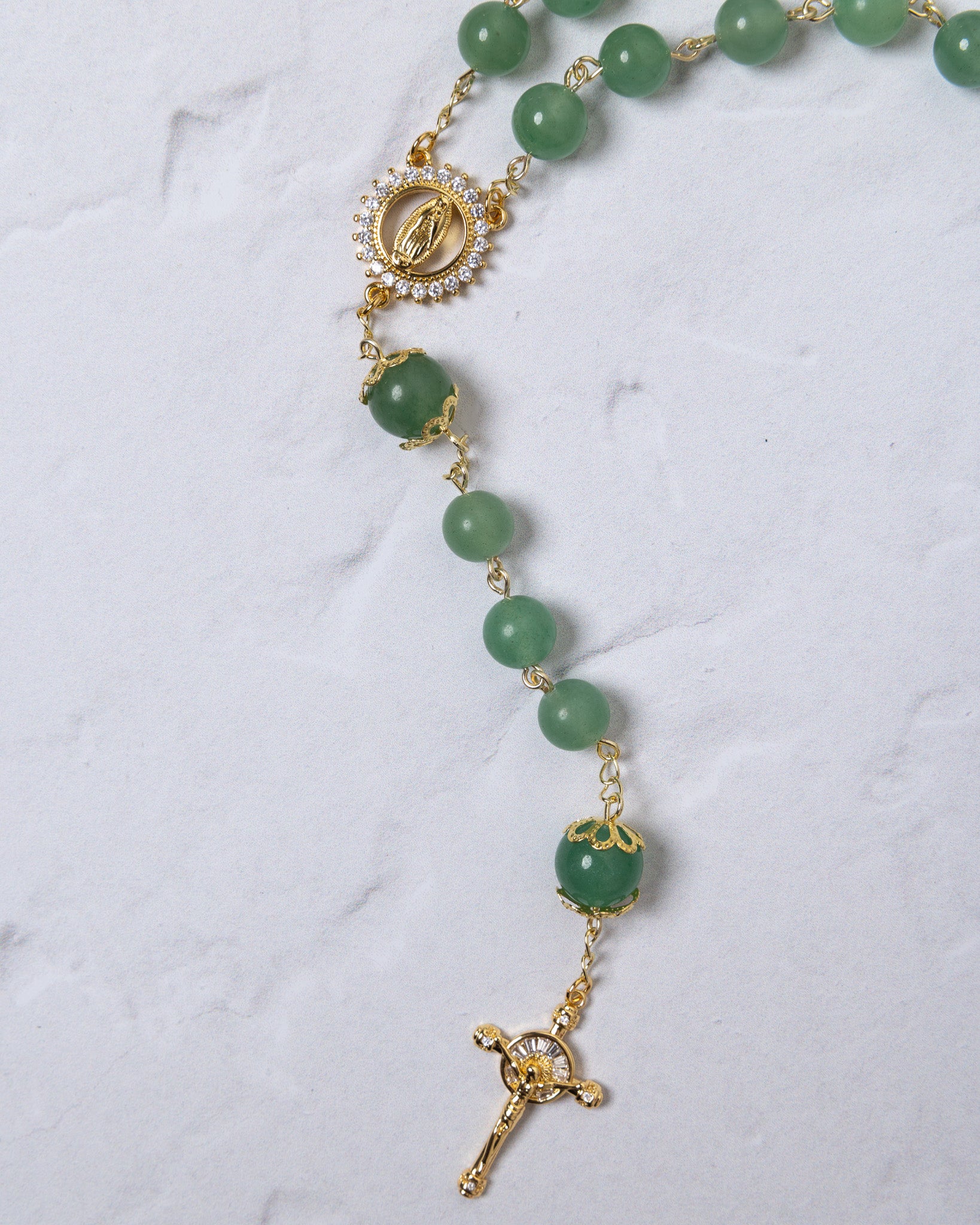 Jadeite rosary with delicate green jade beads, gold accents, and crucifix