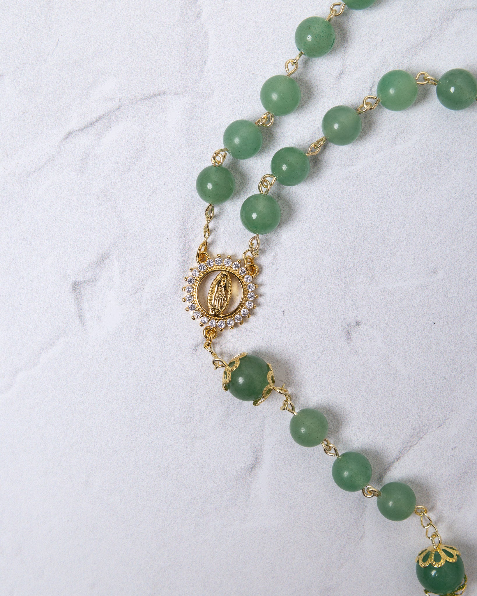 Jadeite rosary with green jade beads, gold accents, Virgin Mary medallion