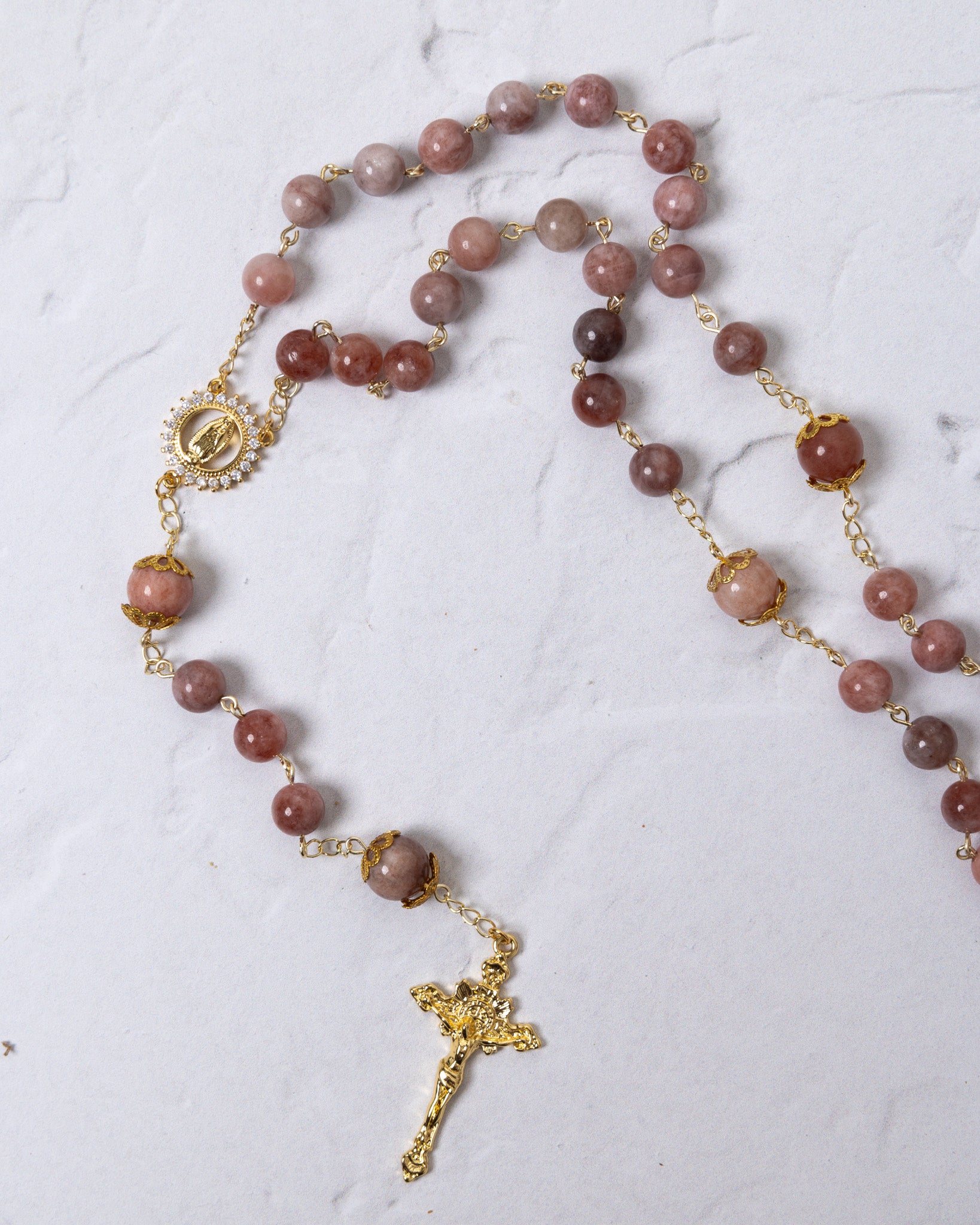 Mater Amoris rosary with rose-pink gemstone beads and gold crucifix