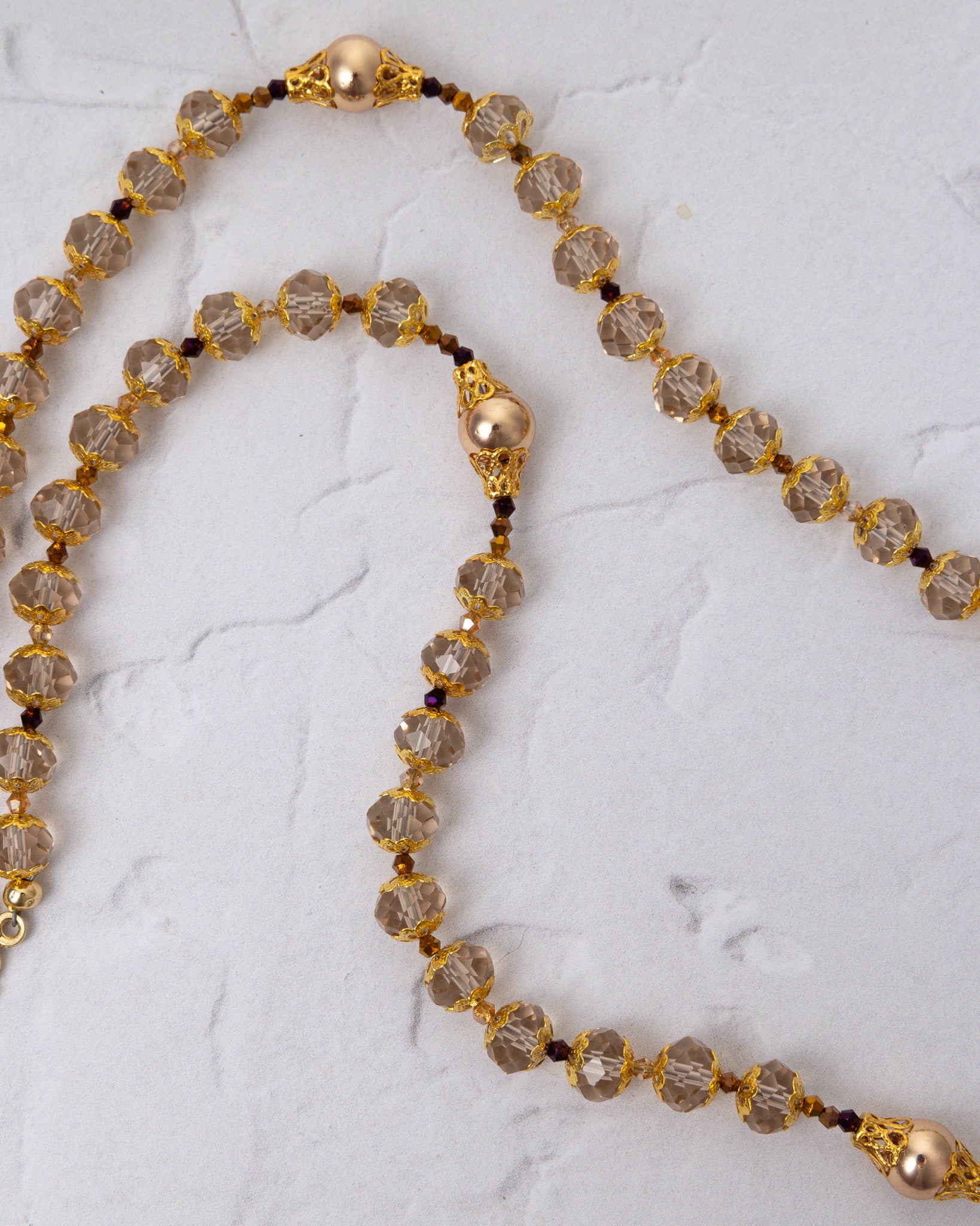 Gloria Aurea Rosary: elegant gold beaded necklace with smoke quartz