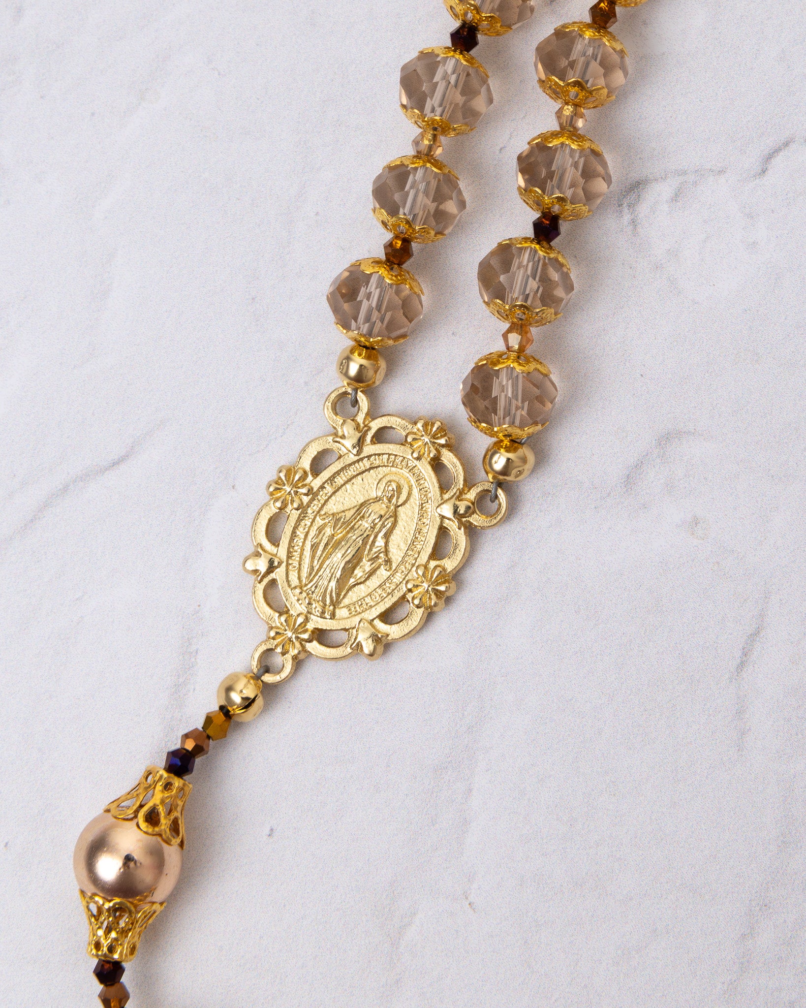 Gloria Aurea gold rosary with smoky quartz beads and Virgin Mary medallion