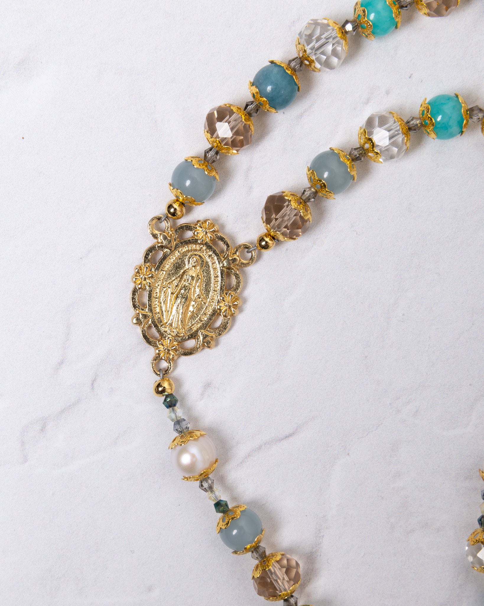 Gloria Maris gold rosary with turquoise beads and Virgin Mary centerpiece