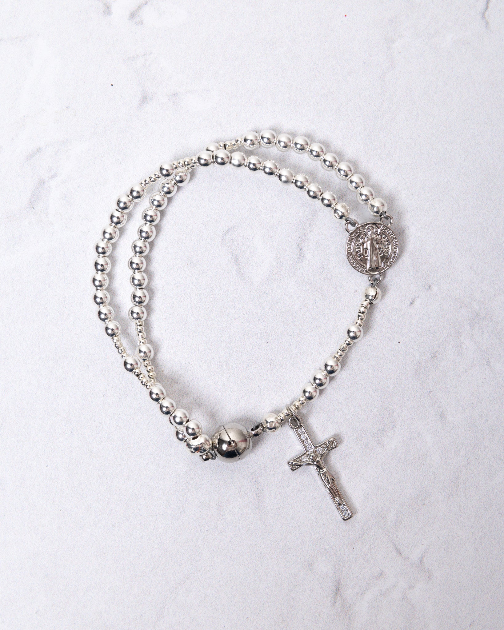 White gold magnetic rosary bracelet with silver medallion and cross