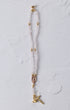 Rose quartz magnetic rosary bracelet with delicate white beads gold toned accents and golden cross pendant