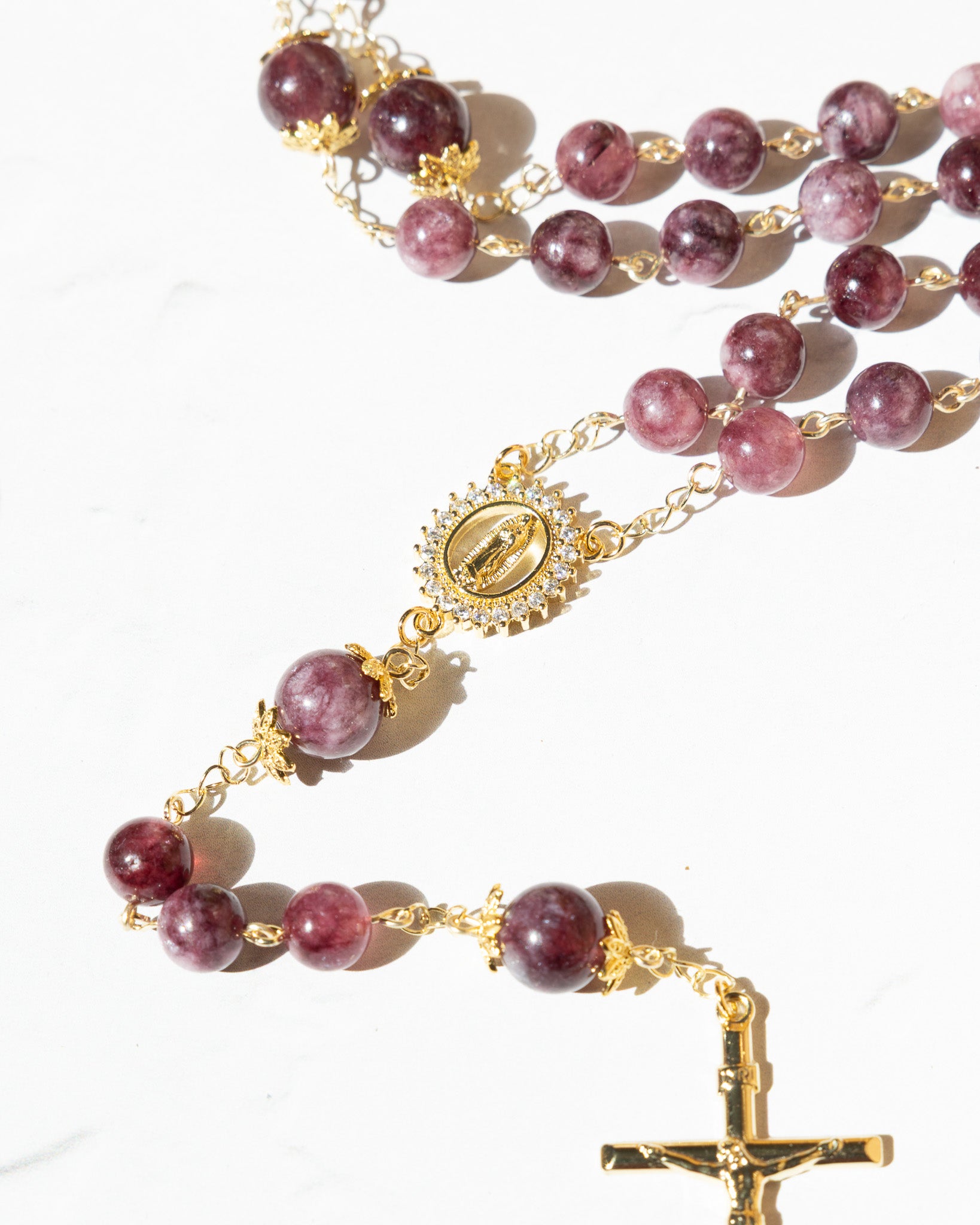 Delicate gold Advent Plum Rosary with purple garnet beads and engraved medallion