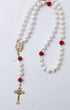 Ivory Rose Pearl Rosary featuring white pearls with red rose accents and gold-toned crucifix and medallion details