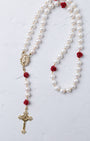 Ivory Rose Pearl Rosary featuring white pearls with red rose accents and gold-toned crucifix and medallion details