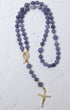 Wisteria bloom rosary featuring a delicate lavender jade bead with gold-toned metal accents and detailed crucifix